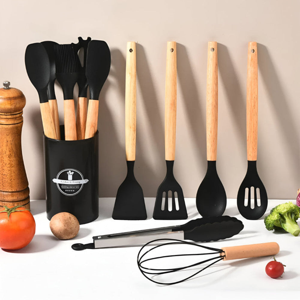 Set of kitchen utensils with wooden handles on a neutral background