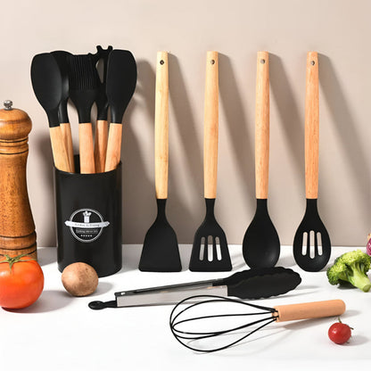 Set of kitchen utensils with wooden handles on a neutral background
